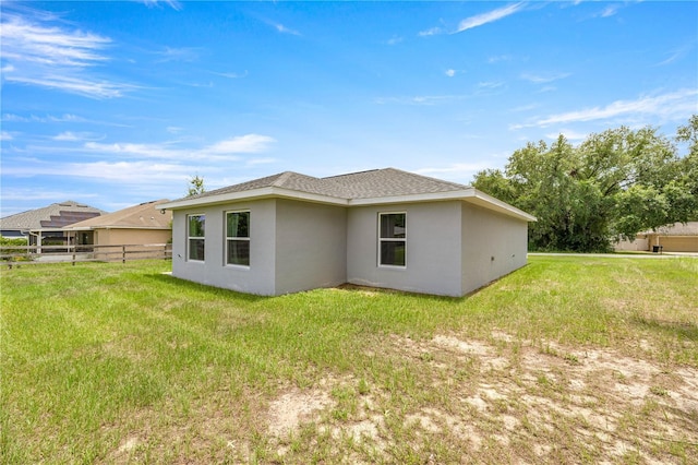 231 Marion Oaks Trl, Ocala, FL 34473 - back of property featuring stucco siding and roof with shingles