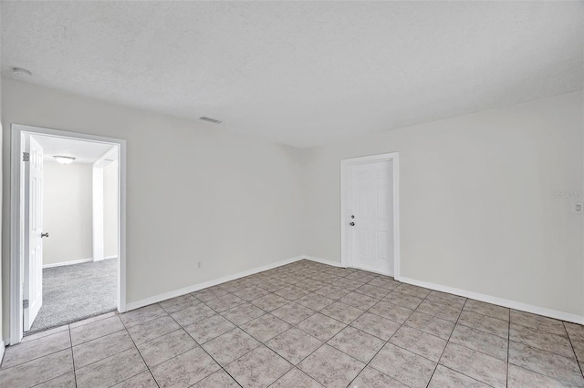 2509 W Crawford St, Tampa, FL 33614 - empty room featuring light tile patterned flooring and baseboards