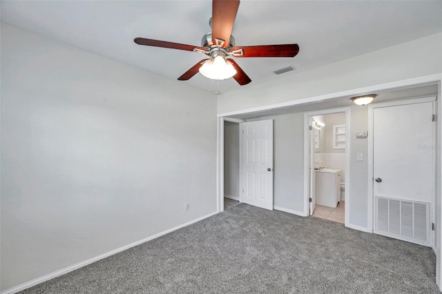 2509 W Crawford St, Tampa, FL 33614 - unfurnished bedroom featuring carpet flooring, ensuite bath, and ceiling fan
