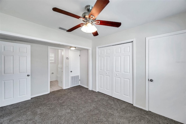 2509 W Crawford St, Tampa, FL 33614 - unfurnished bedroom with carpet floors, ceiling fan, and connected bathroom