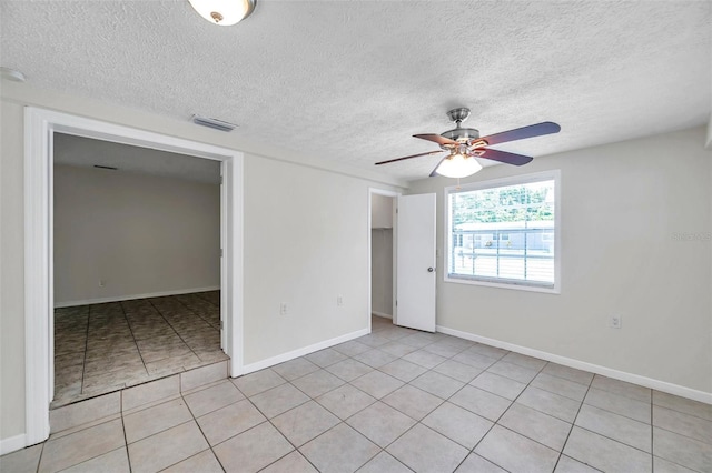 2509 W Crawford St, Tampa, FL 33614 - unfurnished room featuring ceiling fan, a textured ceiling, and light tile patterned flooring