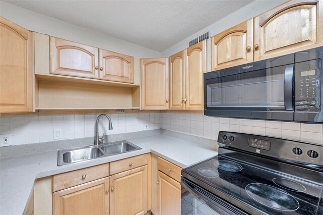 2509 W Crawford St, Tampa, FL 33614 - kitchen featuring black appliances, light brown cabinetry, light countertops, open shelves, and a textured ceiling