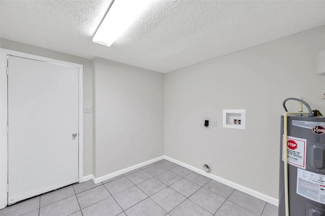 2509 W Crawford St, Tampa, FL 33614 - washroom with hookup for an electric dryer, water heater, hookup for a washing machine, a textured ceiling, and light tile patterned floors