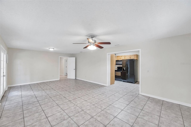 2509 W Crawford St, Tampa, FL 33614 - empty room featuring ceiling fan, light tile patterned flooring, and a textured ceiling