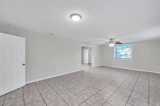 2509 W Crawford St, Tampa, FL 33614 - empty room with a ceiling fan, a textured ceiling, and light tile patterned floors