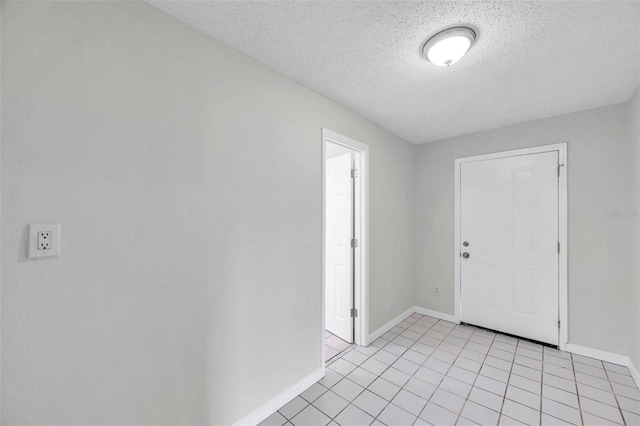 2509 W Crawford St, Tampa, FL 33614 - foyer entrance featuring a textured ceiling and light tile patterned floors