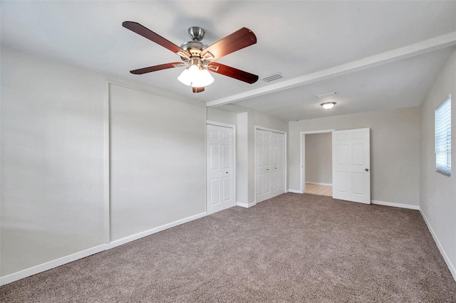 2509 W Crawford St, Tampa, FL 33614 - unfurnished bedroom with carpet flooring, multiple closets, and ceiling fan