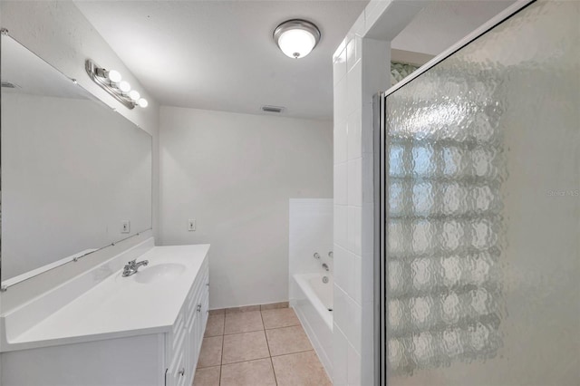 2509 W Crawford St, Tampa, FL 33614 - full bathroom featuring vanity, tile patterned flooring, a garden tub, and a shower stall