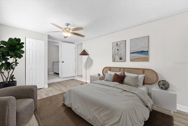 4718 W Oklahoma Ave, Tampa, FL 33616 - bedroom with light wood-style flooring and ceiling fan