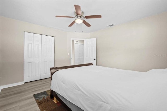 4718 W Oklahoma Ave, Tampa, FL 33616 - bedroom featuring light wood finished floors, a closet, and ceiling fan