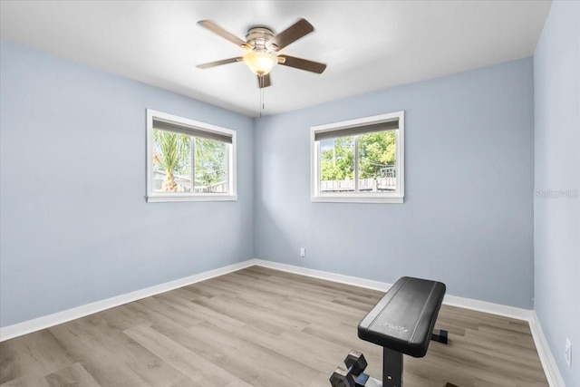 4718 W Oklahoma Ave, Tampa, FL 33616 - workout room featuring a ceiling fan and wood finished floors