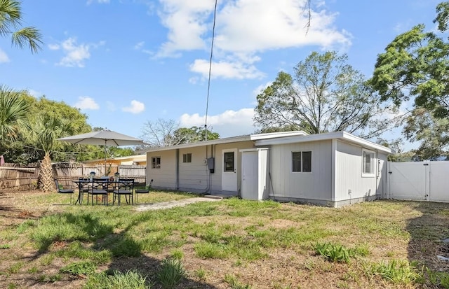 4718 W Oklahoma Ave, Tampa, FL 33616 - back of property with a gate and a fenced backyard