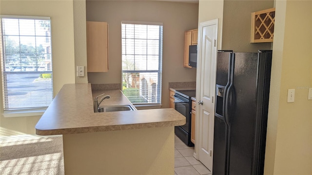 5000 Culbreath Key Way Unit 1-220, Tampa, FL 33611 - kitchen with black appliances, a peninsula, light countertops, light tile patterned flooring, and an office area