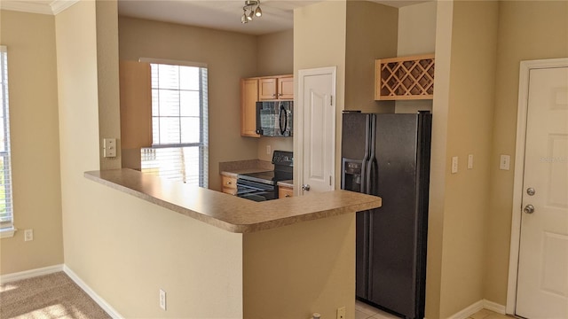 5000 Culbreath Key Way Unit 1-220, Tampa, FL 33611 - kitchen featuring black appliances, a peninsula, and light countertops