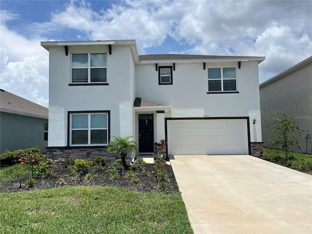 17807 Canopy Pl, Bradenton, FL 34211 - view of front of house featuring stucco siding, stone siding, and a garage