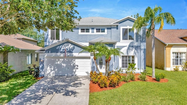 1734 Mapleleaf Blvd, Oldsmar, FL 34677 - view of front of property featuring stucco siding, concrete driveway, and a front lawn
