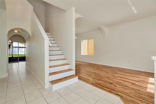 1734 Mapleleaf Blvd, Oldsmar, FL 34677 - stairs featuring arched walkways and wood finished floors
