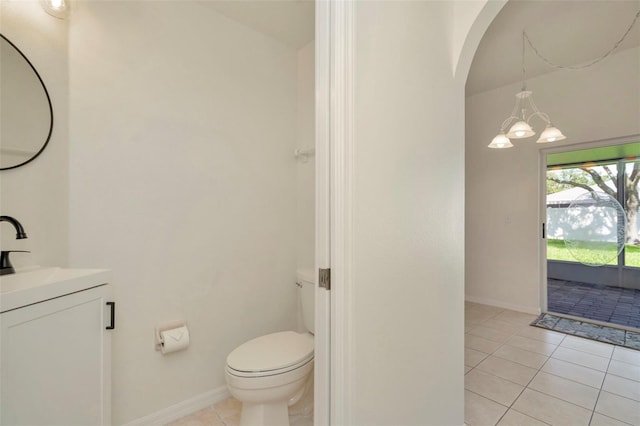 1734 Mapleleaf Blvd, Oldsmar, FL 34677 - bathroom featuring vanity, tile patterned floors, and a chandelier