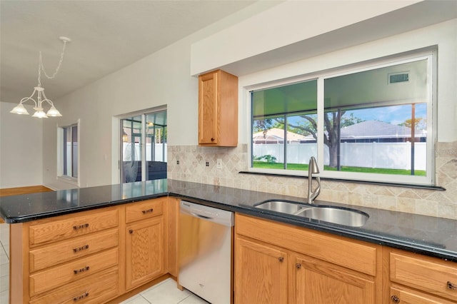 1734 Mapleleaf Blvd, Oldsmar, FL 34677 - kitchen featuring dishwasher, dark stone counters, a peninsula, and tasteful backsplash