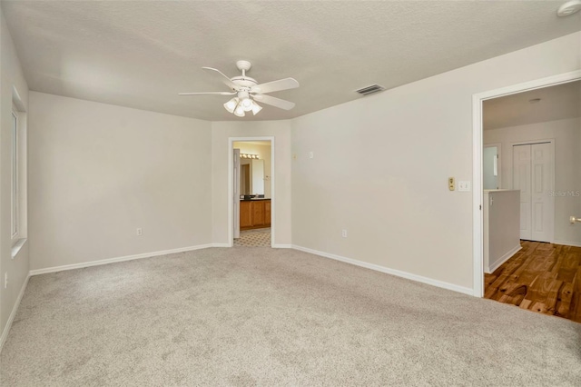 1734 Mapleleaf Blvd, Oldsmar, FL 34677 - carpeted empty room with a ceiling fan and a textured ceiling