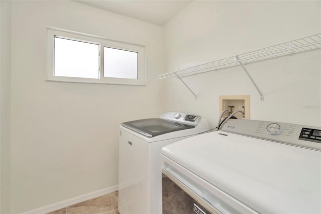 1734 Mapleleaf Blvd, Oldsmar, FL 34677 - washroom with washer and dryer and light tile patterned floors