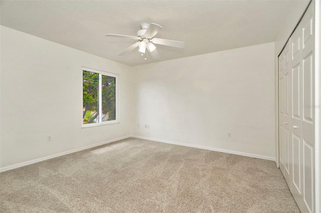 1734 Mapleleaf Blvd, Oldsmar, FL 34677 - unfurnished bedroom with a closet, light colored carpet, and ceiling fan