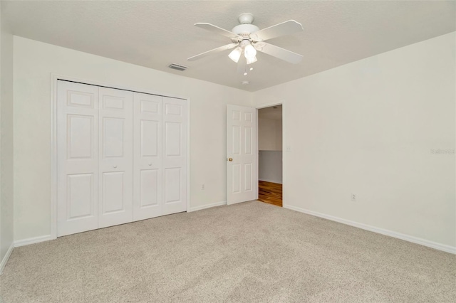 1734 Mapleleaf Blvd, Oldsmar, FL 34677 - unfurnished bedroom featuring carpet, a closet, and ceiling fan