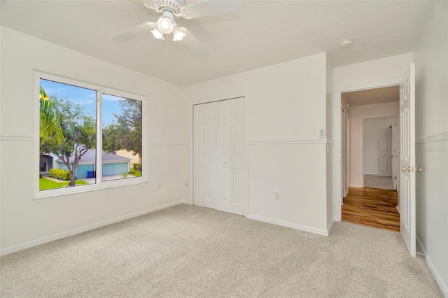 1734 Mapleleaf Blvd, Oldsmar, FL 34677 - unfurnished bedroom with light carpet, a closet, and a ceiling fan