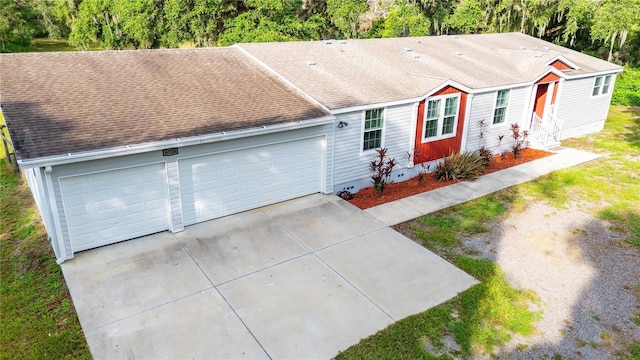6728 Sutton Oaks Ln, Zephyrhills, FL 33541 - view of front facade with a shingled roof, an attached garage, entry steps, and concrete driveway