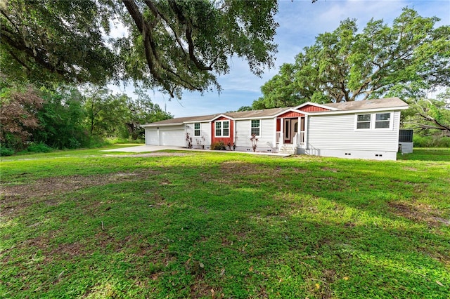 6728 Sutton Oaks Ln, Zephyrhills, FL 33541 - view of front of house with entry steps, crawl space, a garage, and a front lawn