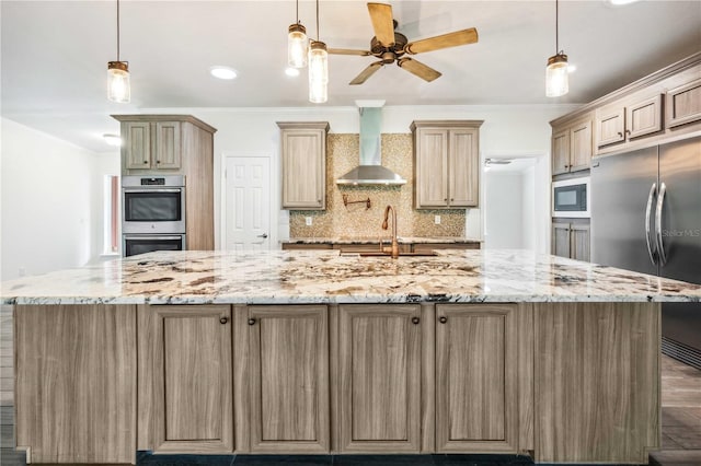 6728 Sutton Oaks Ln, Zephyrhills, FL 33541 - kitchen featuring stainless steel appliances, wall chimney range hood, ceiling fan, a spacious island, and tasteful backsplash