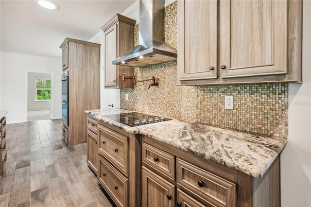6728 Sutton Oaks Ln, Zephyrhills, FL 33541 - kitchen featuring wall chimney exhaust hood, backsplash, black electric stovetop, and light stone countertops