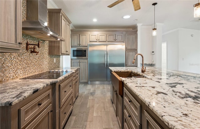 6728 Sutton Oaks Ln, Zephyrhills, FL 33541 - kitchen featuring wall chimney range hood, built in appliances, a ceiling fan, ornamental molding, and light stone countertops