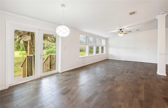 6728 Sutton Oaks Ln, Zephyrhills, FL 33541 - unfurnished room featuring ornamental molding, ceiling fan, and dark wood finished floors
