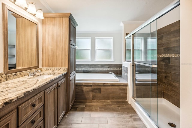 6728 Sutton Oaks Ln, Zephyrhills, FL 33541 - full bath featuring ornamental molding, vanity, a garden tub, and a stall shower