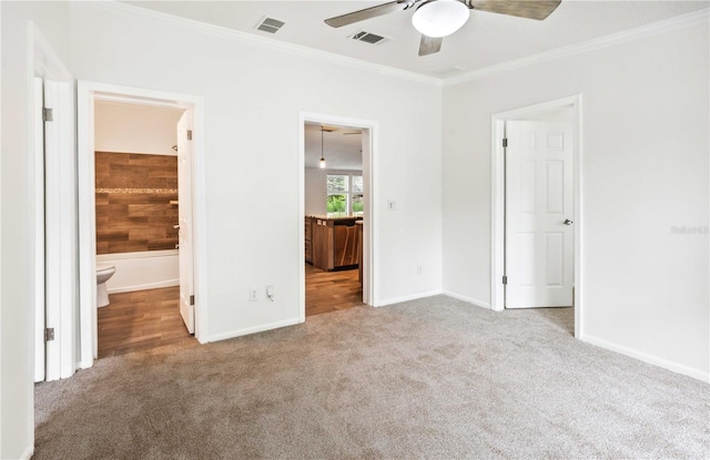 6728 Sutton Oaks Ln, Zephyrhills, FL 33541 - unfurnished bedroom featuring carpet floors, ornamental molding, ensuite bath, and ceiling fan