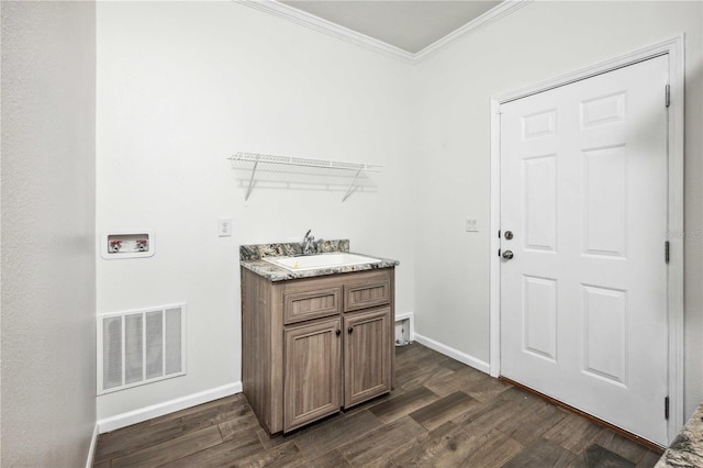 6728 Sutton Oaks Ln, Zephyrhills, FL 33541 - washroom featuring crown molding, washer hookup, and dark wood-style floors