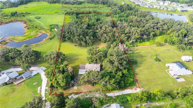 6728 Sutton Oaks Ln, Zephyrhills, FL 33541 - aerial overview of property's location with a large body of water and property parcel outlined