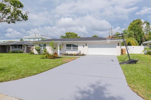 1723 Cypress Ave, Belleair, FL 33756 - ranch-style home featuring an attached garage, driveway, and stucco siding