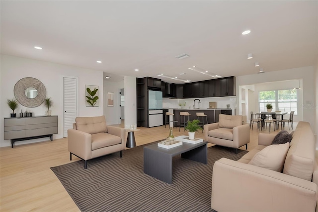 1723 Cypress Ave, Belleair, FL 33756 - living room featuring light wood-type flooring and recessed lighting