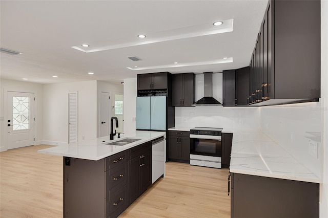 1723 Cypress Ave, Belleair, FL 33756 - kitchen featuring white range with electric stovetop, wall chimney exhaust hood, stainless steel dishwasher, light wood finished floors, and recessed lighting
