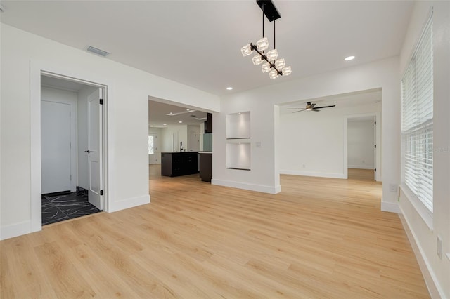1723 Cypress Ave, Belleair, FL 33756 - unfurnished living room featuring light wood finished floors, a ceiling fan, and recessed lighting