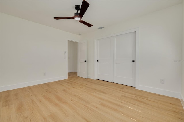 1723 Cypress Ave, Belleair, FL 33756 - unfurnished bedroom with light wood finished floors, a closet, and a ceiling fan