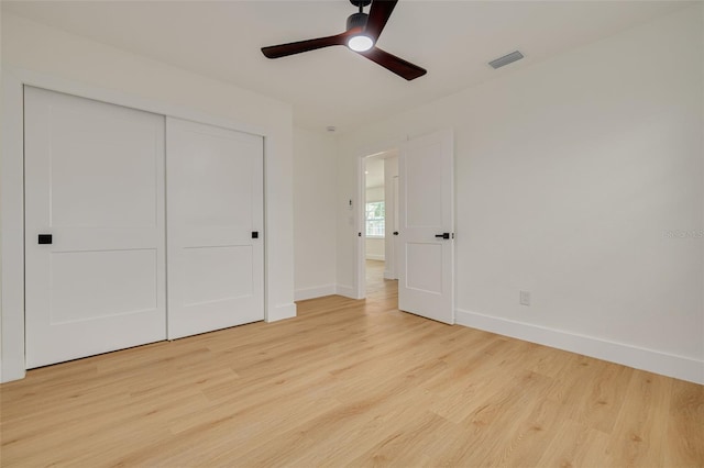 1723 Cypress Ave, Belleair, FL 33756 - unfurnished bedroom with light wood-style floors, a closet, and ceiling fan