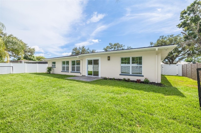 1723 Cypress Ave, Belleair, FL 33756 - rear view of house featuring stucco siding, a fenced backyard, and a gate