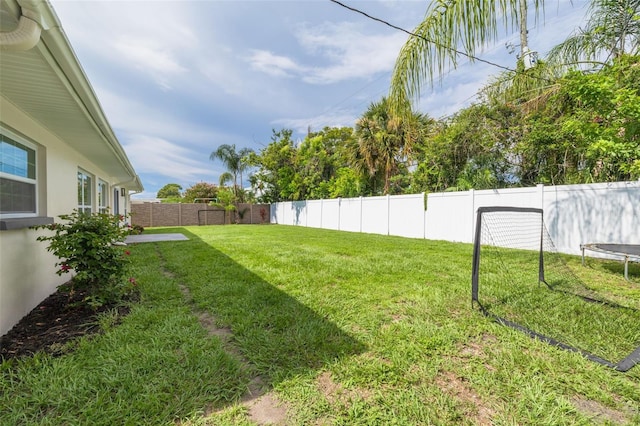 1723 Cypress Ave, Belleair, FL 33756 - fenced backyard featuring a trampoline