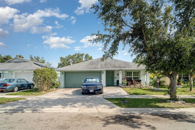 1827 Peaceful Palm St, Ruskin, FL 33570 - ranch-style house with driveway, a garage, and stucco siding