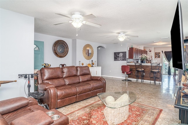 1827 Peaceful Palm St, Ruskin, FL 33570 - living area with a ceiling fan and a textured ceiling