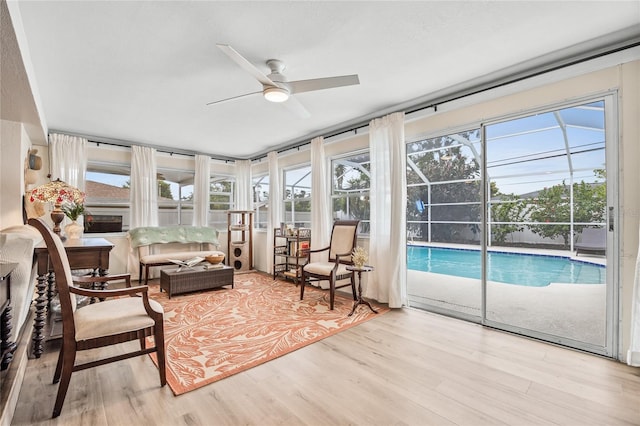 1251 Fairway Dr, Dunedin, FL 34698 - sunroom / solarium with ceiling fan, plenty of natural light, and a swimming pool