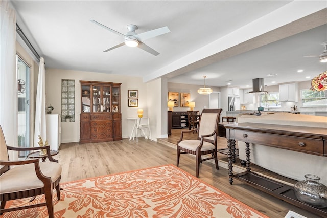 1251 Fairway Dr, Dunedin, FL 34698 - living area with a ceiling fan and light wood-style flooring